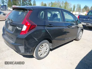 2015 Honda Fit LX with VIN 3HGGK5H58FM765907, listed as a IAAI auction lot 42061158 with 120,178 mi miles. Bid and sale history available at carsss.com. Image 4.