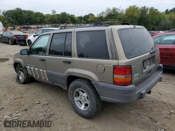 1996 Jeep Grand Cherokee Laredo with VIN 1J4GZ58S7TC403946, listed as a Copart auction lot 71785734 with 231,780 mi miles and Salvage Title. Bid and sale history available at carsss.com. Image 2.