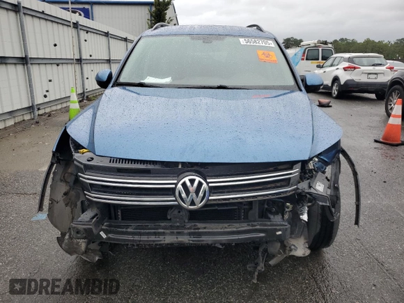 2017 Volkswagen Tiguan S with VIN WVGAV7AX7HW501479, listed as a Copart auction lot 56582705 with 157,414 mi miles and Clean Title. Bid and sale history available at DreamBid. Image 5.