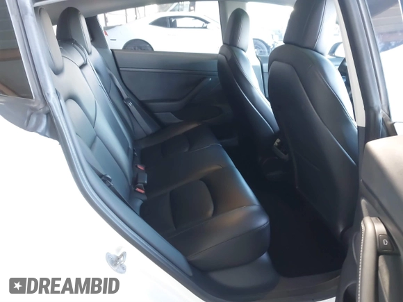 2021 Tesla Model 3 Performance with VIN 5YJ3E1EC4MF097993, listed as a IAAI auction lot 41366615 with 30,735 mi miles and . Bid and sale history available at DreamBid. Image 8.