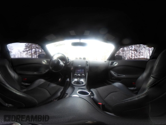 2014 Nissan 370Z Nismo z VIN JN1AZ4EH0EM631950, wystawiony jako IAAI lot #41685567 z przebiegiem 103 282 mil mil oraz . Historia ofert i sprzedaży dostępna na DreamBid. Obrazek 18.