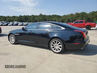 2015 Jaguar XJ with VIN SAJWA1CZ7F8V83167, listed as a Copart auction lot 74991144 with 94,502 mi miles and Salvage Title. Bid and sale history available at carsss.com. Image 2.
