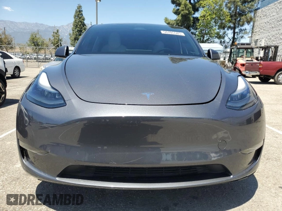 2024 Tesla Model Y Long Range with VIN 7SAYGDEEXRA215975, listed as a Copart auction lot 56705585 with 20,554 mi miles and Salvage Title. Bid and sale history available at DreamBid. Image 5.
