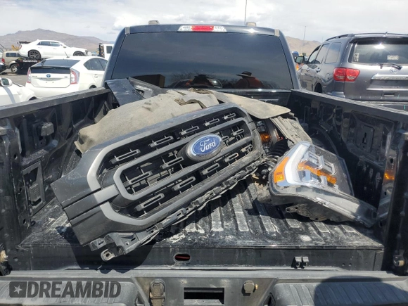 2023 Ford F-150 XL z VIN 1FTFW1ED9PFA77211, wystawiony jako Copart lot #54770075 z przebiegiem 82 712 mil mil oraz Szkoda całkowita • Salvage title. Historia ofert i sprzedaży dostępna na DreamBid. Obrazek 12.