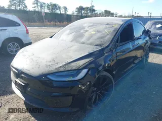 2023 Tesla Model X with VIN 7SAXCAE59PF377408, listed as a IAAI auction lot 41176738 with 32,496 mi miles and . Bid and sale history available at DreamBid. Image 20.