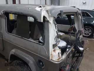 2006 Jeep Wrangler Unlimited LWB with VIN 1J4FA44S96P714309, listed as a IAAI auction lot 41252391 with 164,720 mi miles. Bid and sale history available at carsss.com. Image 6.
