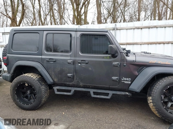 2020 Jeep Wrangler Unlimited Sport z VIN 1C4HJXDN3LW164701, wystawiony jako IAAI lot #41200437 z przebiegiem 102 272 mil mil oraz . Historia ofert i sprzedaży dostępna na DreamBid. Obrazek 13.
