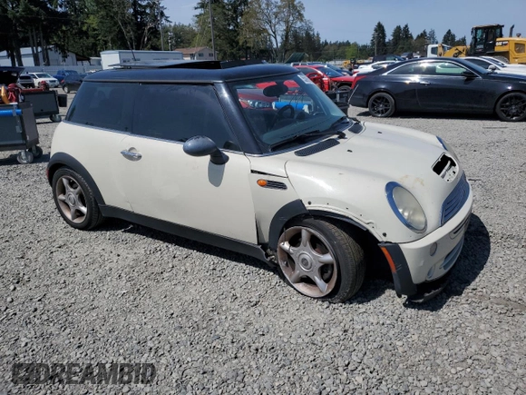 2006 MINI Hardtop with VIN WMWRC33586TJ77908, listed as a Copart auction lot 55095525 with 143,810 mi miles and Salvage title. Bid and sale history available at DreamBid. Image 4.