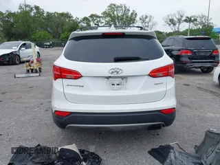 2014 Hyundai Santa Fe with VIN 5XYZU3LB9EG229255, listed as a IAAI auction lot 42407410 with 201,523 mi miles and . Bid and sale history available at DreamBid. Image 17.