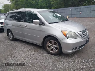 2010 Honda Odyssey Touring with VIN 5FNRL3H9XAB090134, listed as a IAAI auction lot 42560493 with 222,348 mi miles and . Bid and sale history available at DreamBid. Image 1.