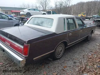 1987 Lincoln Town Car with VIN 1LNBM81F5HY704217, listed as a IAAI auction lot 41855678 with 86,794 mi miles. Bid and sale history available at carsss.com. Image 4.