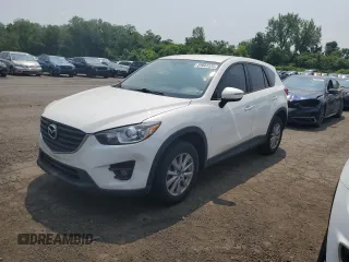 2016 Mazda CX-5 Touring z VIN JM3KE4CY1G0820270, wystawiony jako Copart lot #59664535 z przebiegiem 129 709 mil mil oraz Czysty tytuł • Clean title. Historia ofert i sprzedaży dostępna na DreamBid. Obrazek 1.