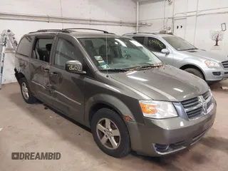2010 Dodge Grand Caravan SXT z VIN 2D4RN5D14AR416488, wystawiony jako IAAI lot #38412602 z przebiegiem 136 997 mil mil oraz . Historia ofert i sprzedaży dostępna na DreamBid. Obrazek 1.