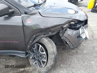 2021 Jeep Compass Trailhawk with VIN 3C4NJDDB6MT561074, listed as a IAAI auction lot 42125886 with 77,293 mi miles and . Bid and sale history available at DreamBid. Image 20.