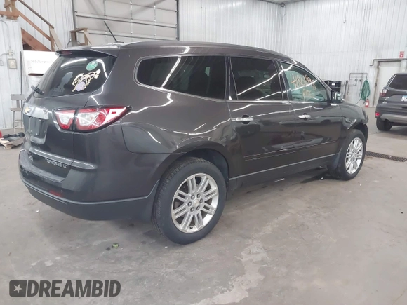 2015 Chevrolet Traverse LT with VIN 1GNKVGKD1FJ220650, listed as a IAAI auction lot 41801898 with 112,878 mi miles and . Bid and sale history available at DreamBid. Image 4.