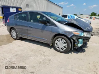 2010 Honda Insight LX with VIN JHMZE2H52AS043392, listed as a Copart auction lot 61347625 with 194,248 mi miles and Salvage title. Bid and sale history available at DreamBid. Image 4.