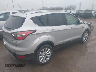 2017 Ford Escape Titanium with VIN 1FMCU0J96HUC21987, listed as a IAAI auction lot 41971376 with 97,488 mi miles and . Bid and sale history available at DreamBid. Image 4.