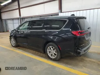 2023 Chrysler Pacifica Touring L with VIN 2C4RC1BG3PR582271, listed as a Copart auction lot 51644595 with 57,930 mi miles and Salvage title. Bid and sale history available at DreamBid. Image 2.