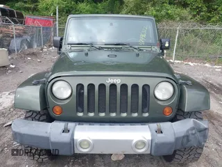 2008 Jeep Wrangler Sahara with VIN 1J4FA54178L647426, listed as a IAAI auction lot 42496322 with 157,016 mi miles and . Bid and sale history available at DreamBid. Image 12.