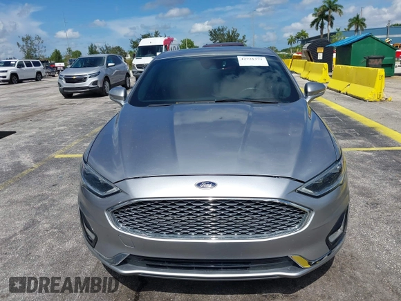 2020 Ford Fusion Titanium with VIN 3FA6P0D95LR199443, listed as a IAAI auction lot 42721371 with 77,592 mi miles and . Bid and sale history available at DreamBid. Image 17.