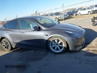 2023 Tesla Model Y Long Range with VIN 7SAYGAEEXPF714760, listed as a IAAI auction lot 41748398 with 49,802 mi miles and . Bid and sale history available at DreamBid. Image 14.