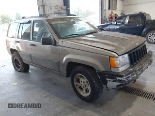 1998 Jeep Grand Cherokee Laredo with VIN 1J4GZ58S7WC370838, listed as a IAAI auction lot 42528566 with 231,642 mi miles and . Bid and sale history available at DreamBid. Image 1.