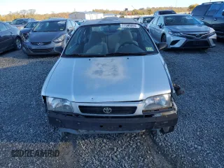 1997 Toyota Tercel CE z VIN JT2AC52L1V0227973, wystawiony jako Copart lot #77300554 z przebiegiem 301 799 mil mil oraz Szkoda całkowita • Salvage title. Historia ofert i sprzedaży dostępna na DreamBid. Obrazek 5.