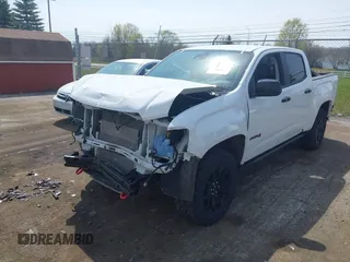 2021 GMC Canyon 4WD AT4 z VIN 1GTG6FENXM1291689, wystawiony jako IAAI lot #42038884 z przebiegiem 54 884 mil mil oraz . Historia ofert i sprzedaży dostępna na DreamBid. Obrazek 2.