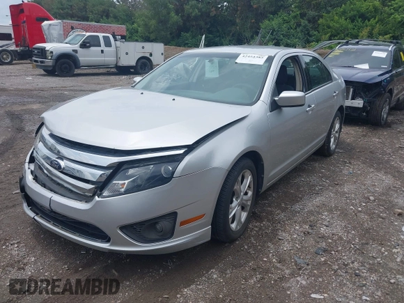 2012 Ford Fusion SE z VIN 3FAHP0HA3CR421636, wystawiony jako IAAI lot #42454385 z przebiegiem 138 282 mil mil oraz . Historia ofert i sprzedaży dostępna na DreamBid. Obrazek 18.