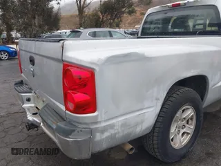 2005 Dodge Dakota SLT with VIN 1D7HE42K05S231198, listed as a IAAI auction lot 41552349 with 149,915 mi miles and . Bid and sale history available at carsss.com. Image 6.