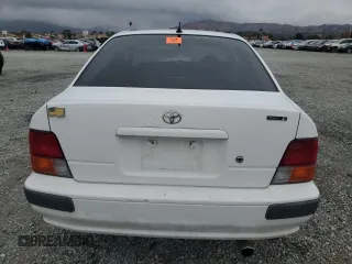 1996 Toyota Tercel DX z VIN JT2AC52L5T0145290, wystawiony jako Copart lot #45027855 z przebiegiem 186 673 mil mil oraz Szkoda całkowita • Salvage title. Historia ofert i sprzedaży dostępna na DreamBid. Obrazek 6.