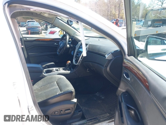 2013 Cadillac SRX Performance Collection with VIN 3GYFNDE33DS637155, listed as a IAAI auction lot 41977706 with 140,668 mi miles and . Bid and sale history available at DreamBid. Image 5.