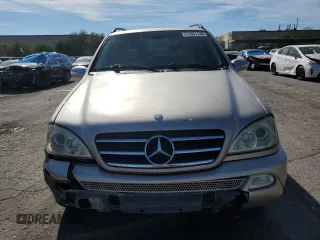 2004 Mercedes-Benz M-Class 5.0L with VIN 4JGAB75E64A488281, listed as a Copart auction lot 77031744 with 128,699 mi miles and Salvage Title. Bid and sale history available at carsss.com. Image 5.