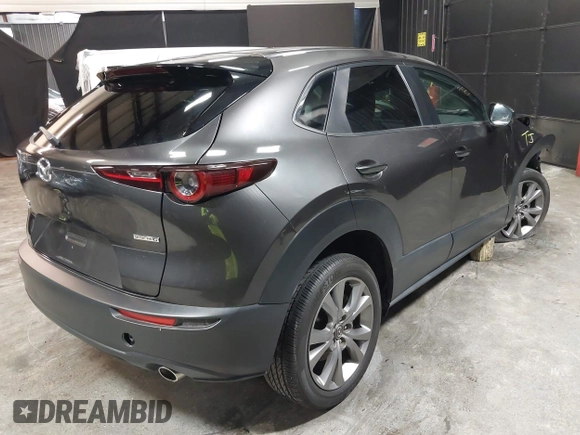 2021 Mazda CX-30 Preferred with VIN 3MVDMBCL1MM247701, listed as a IAAI auction lot 42299009 with 15,880 mi miles and . Bid and sale history available at DreamBid. Image 4.