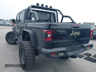 2020 Jeep Gladiator Rubicon z VIN 1C6JJTBG7LL102189, wystawiony jako IAAI lot #42320968 z przebiegiem 68 266 mil mil oraz . Historia ofert i sprzedaży dostępna na DreamBid. Obrazek 3.