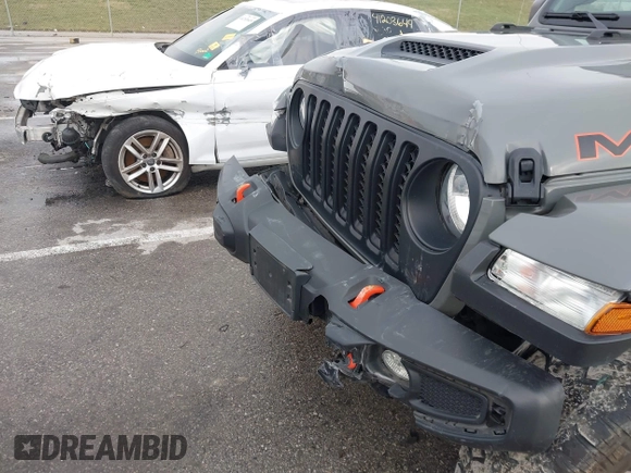 2022 Jeep Gladiator Mojave z VIN 1C6JJTEG8NL130971, wystawiony jako IAAI lot #41163074 z przebiegiem 47 142 mil mil oraz . Historia ofert i sprzedaży dostępna na DreamBid. Obrazek 6.
