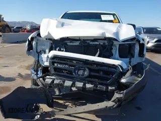 2021 Toyota Tacoma SR with VIN 3TYRX5GN8MT013815, listed as a IAAI auction lot 42311783 with 28,327 mi miles and . Bid and sale history available at DreamBid. Image 6.