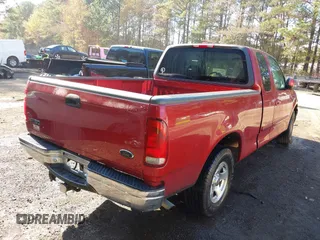 2000 Ford F-150 XL with VIN 1FTRX17L7YKA59717, listed as a IAAI auction lot 40887691 with 104,095 mi miles. Bid and sale history available at carsss.com. Image 4.