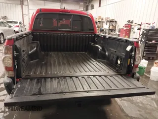 2015 Toyota Tacoma with VIN 3TMLU4EN3FM196518, listed as a IAAI auction lot 41198481 with 96,277 mi miles and . Bid and sale history available at DreamBid. Image 13.