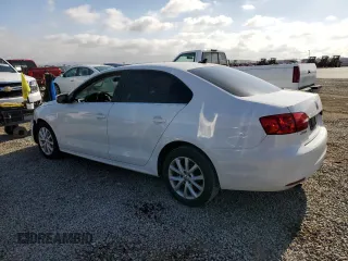 2013 Volkswagen Jetta SE with VIN 3VWDP7AJ3DM384014, listed as a Copart auction lot 56207025 with 112,627 mi miles and Salvage title. Bid and sale history available at DreamBid. Image 2.