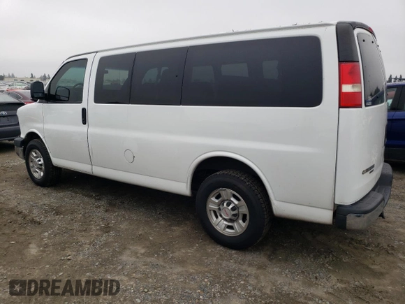 2012 Chevrolet Express Passenger 1LT with VIN 1GAZGYFG8C1174282, listed as a Copart auction lot 86012024 with 170,680 mi miles and Salvage title. Bid and sale history available at DreamBid. Image 2.