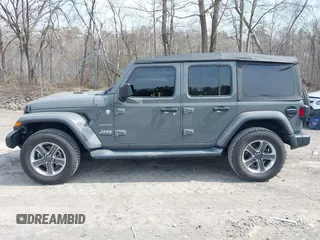 2018 Jeep Wrangler Unlimited Sahara z VIN 1C4HJXEN8JW329816, wystawiony jako IAAI lot #42055851 z przebiegiem 70 298 mil mil oraz . Historia ofert i sprzedaży dostępna na DreamBid. Obrazek 14.