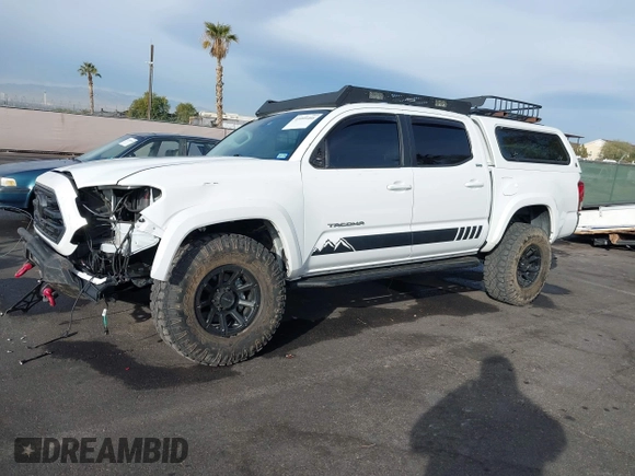 2019 Toyota Tacoma SR z VIN 3TMCZ5AN6KM284101, wystawiony jako IAAI lot #41099466 z przebiegiem 36 119 mil mil oraz . Historia ofert i sprzedaży dostępna na DreamBid. Obrazek 14.