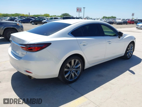 2021 Mazda 6 Touring with VIN JM1GL1VM4M1618686, listed as a IAAI auction lot 42079730 with 55,539 mi miles and . Bid and sale history available at DreamBid. Image 4.