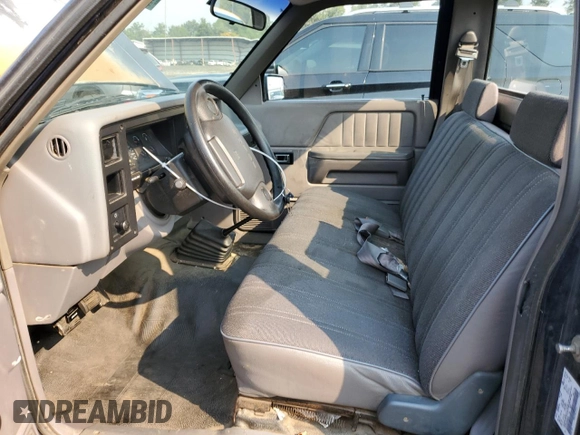 1994 Dodge Dakota z VIN 1B7FL26XXRS606540, wystawiony jako Copart lot #70103064 z przebiegiem 123 850 mil mil oraz Czysty tytuł • Clean title. Historia ofert i sprzedaży dostępna na DreamBid. Obrazek 7.