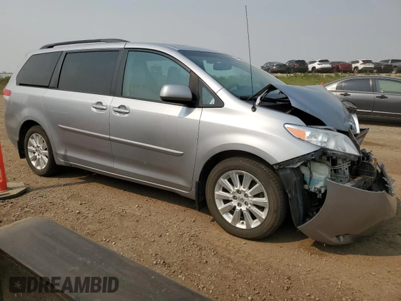 2014 Toyota Sienna Limited with VIN 5TDDK3DC4ES073698, listed as a Copart auction lot 60848915 with 418,121 mi miles and Salvage title. Bid and sale history available at DreamBid. Image 4.