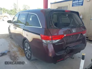 2014 Honda Odyssey Touring with VIN 5FNRL5H90EB080889, listed as a IAAI auction lot 42085305 with 123,286 mi miles and . Bid and sale history available at carsss.com. Image 3.