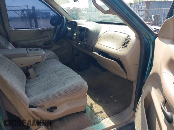 1998 Ford F-150 with VIN 1FTRX18L2WKA67414, listed as a IAAI auction lot 42583873 with 189,546 mi miles and . Bid and sale history available at DreamBid. Image 5.