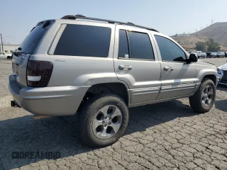 2001 Jeep Grand Cherokee Limited with VIN 1J4GW58N11C721108, listed as a Copart auction lot 60176915 with 257,907 mi miles and Salvage title. Bid and sale history available at DreamBid. Image 3.