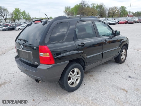 2007 Kia Sportage LX with VIN KNDJE723077397667, listed as a IAAI auction lot 42011122 with 218,744 mi miles. Bid and sale history available at carsss.com. Image 4.